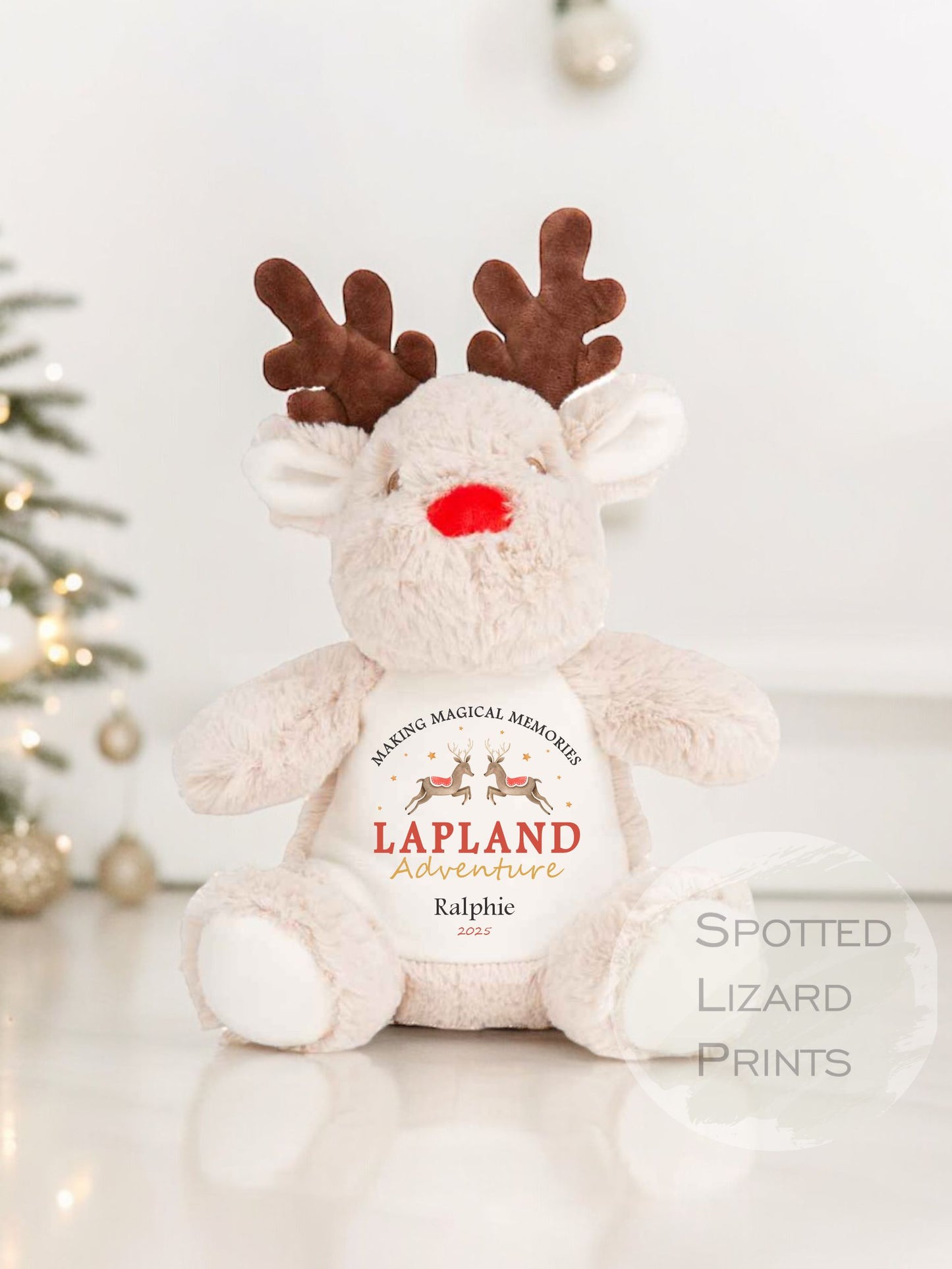 Plush reindeer toy with 'Lapland Adventures' text on a white background