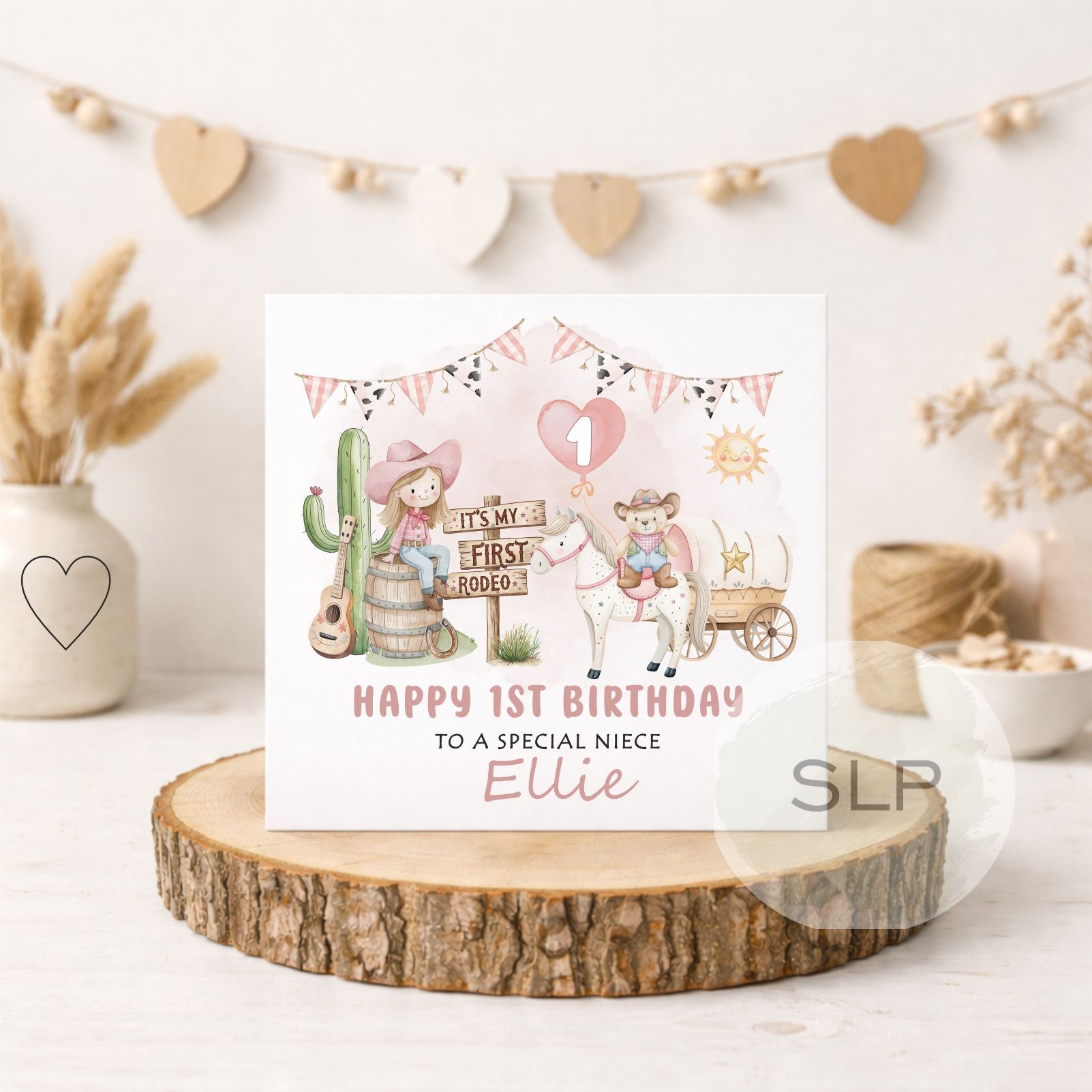 Personalised first rodeo 1st birthday card for a special girl. Cute pink cowgirl, pony and western design personalised with her name and relationship.