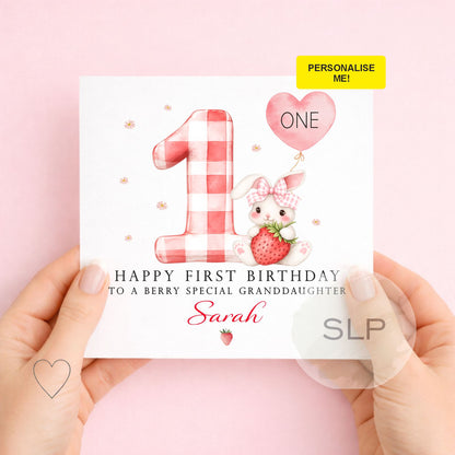 Personalised 1st birthday card featuring a cute strawberry bunny and pink gingham number one. Customise with her name and relationship for a berry special birthday.