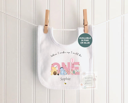 Personalised 1st birthday baby outfit available in pink or blue. Add their name and choose a first birthday bib, baby vest or sleepsuit for their special day.