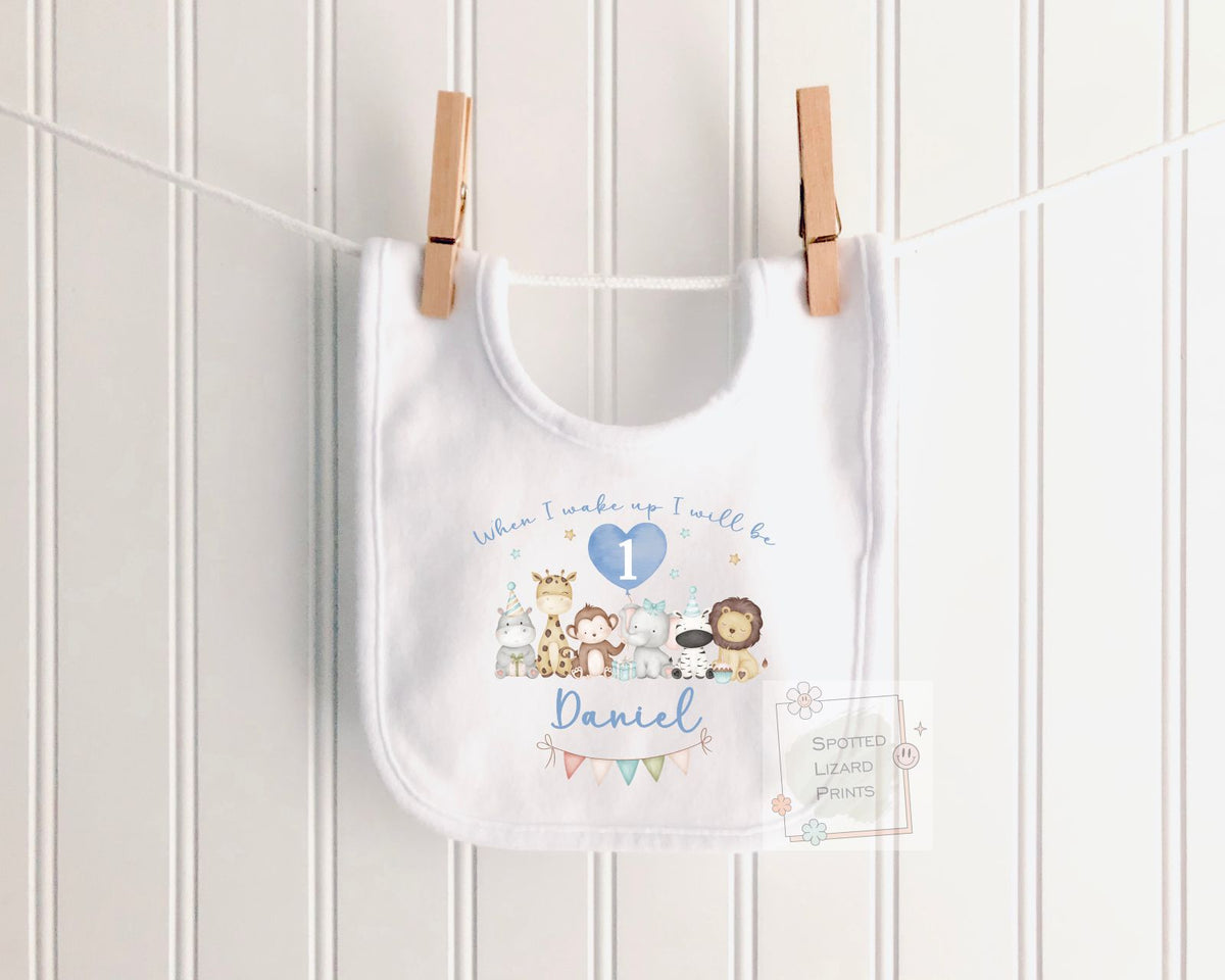 Personalised 1st birthday baby outfit with cute safari animals and custom name. Choose a bib, baby vest or sleepsuit for their special first birthday