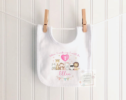 Personalised 1st birthday girl outfit with cute safari animals and custom name. Choose a baby bib, vest or sleepsuit for her special first birthday.