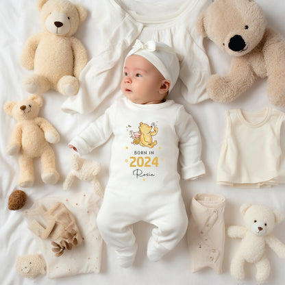 Born in 2024 personalised with a name baby sleepsuit with winnie the pooh