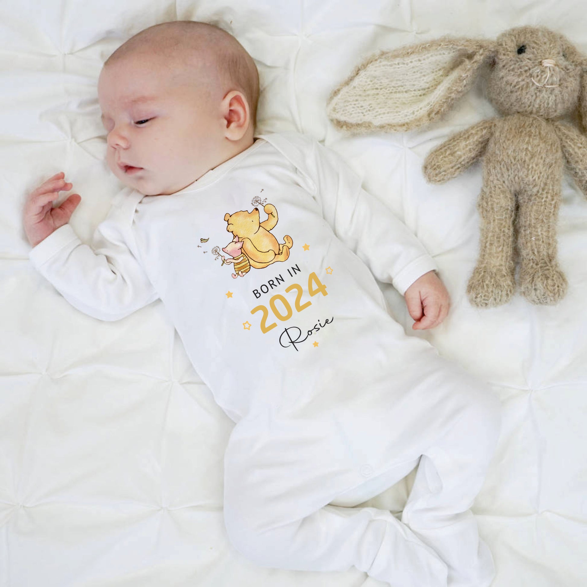 Born in 2024 personalised with a name baby sleepsuit with winnie the pooh