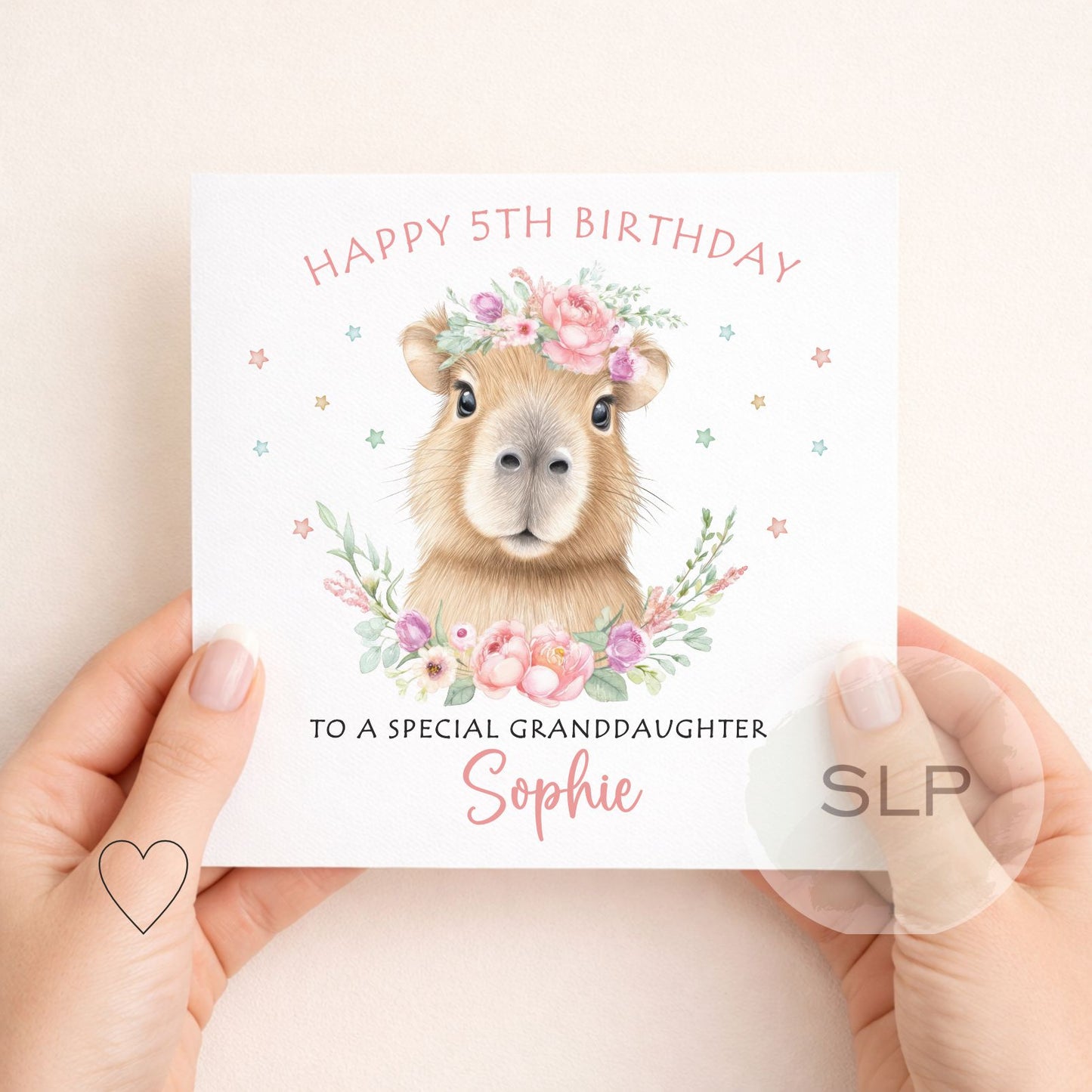Cute personalised capybara birthday card with custom name, age and relationship. A pretty floral animal card for daughters, granddaughters and capybara fans.