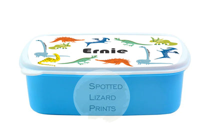 Blue lunch box. Dinosaur themed. Personalised with a name.