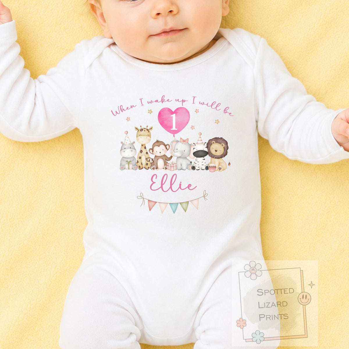 Personalised 1st birthday girl outfit with cute safari animals and custom name. Choose a baby bib, vest or sleepsuit for her special first birthday.