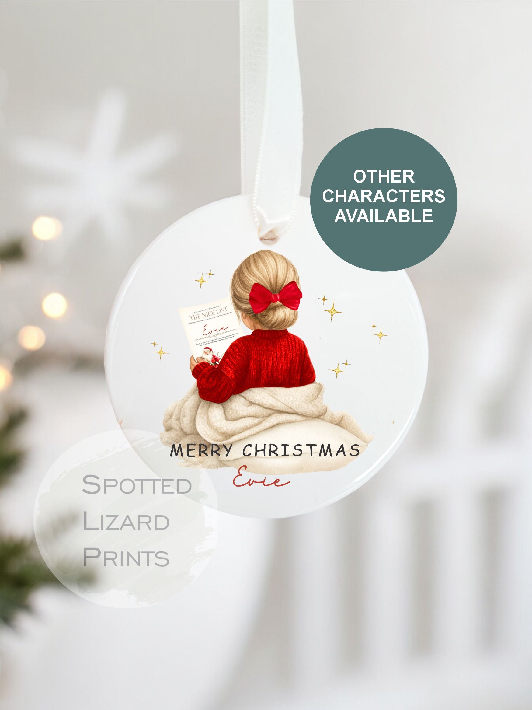 Christmas ornament with a child in a red sweater and bow, featuring 'Spotted Lizard Prints' branding.