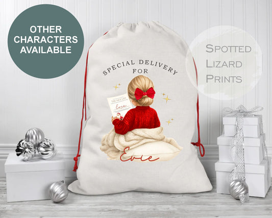Personalized Christmas gift sack with a child in a Santa hat and text