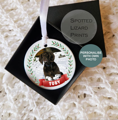 Personalised ceramic Christmas pet bauble hanging on a white ribbon