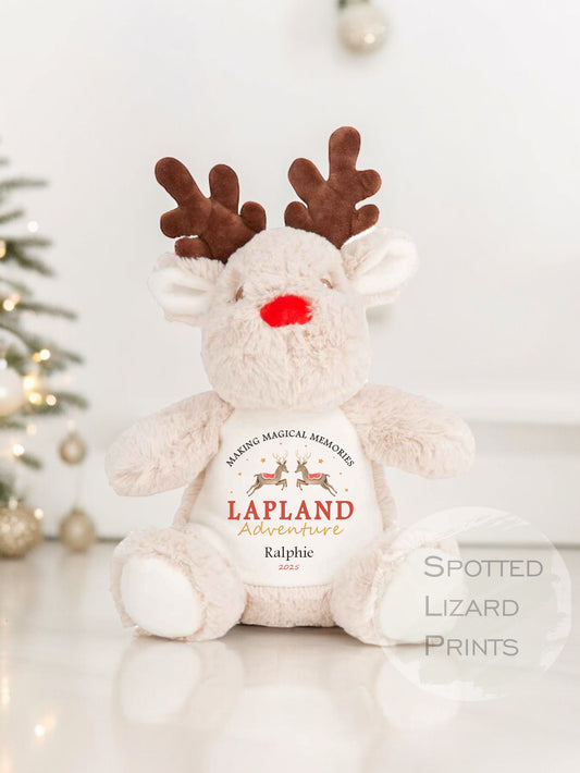 Plush reindeer toy with 'Lapland Adventures' text on a white background
