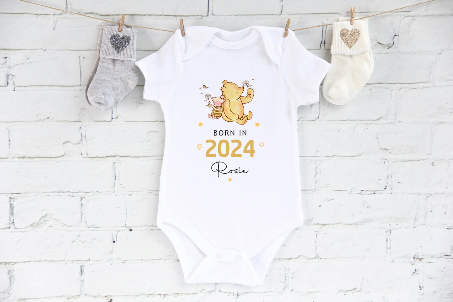 Born in 2024 personalised with a name baby vest with winnie the pooh