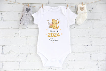 Born in 2024 personalised with a name baby vest with winnie the pooh