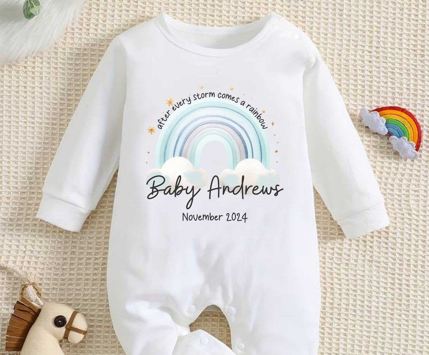 personalised after every storm comes a rainbow sleepsuit